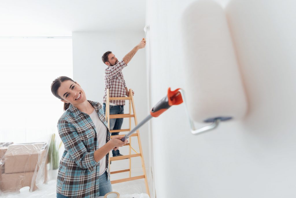 a person painting a wall