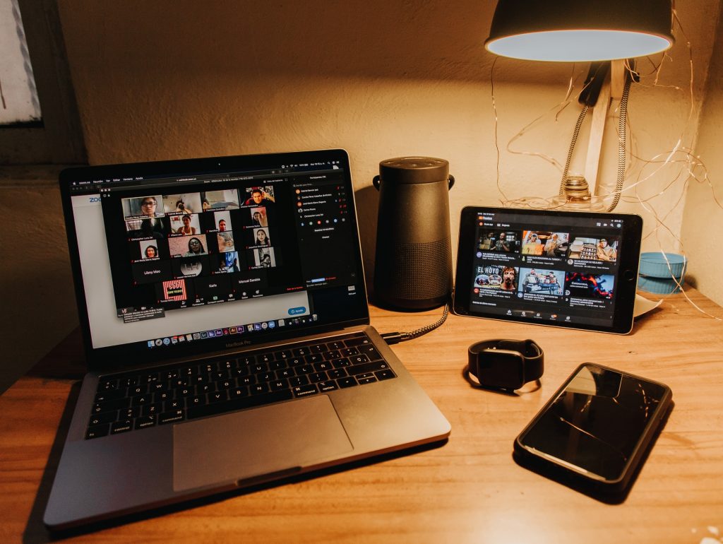 a laptop and a mobile phone on a desk