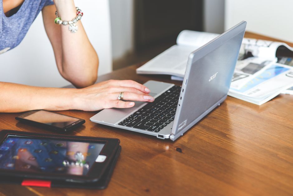 person using cloud-integrated productivity tools on a laptop - best email service for personal use